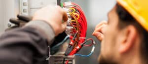 Electrician tests electrical wires